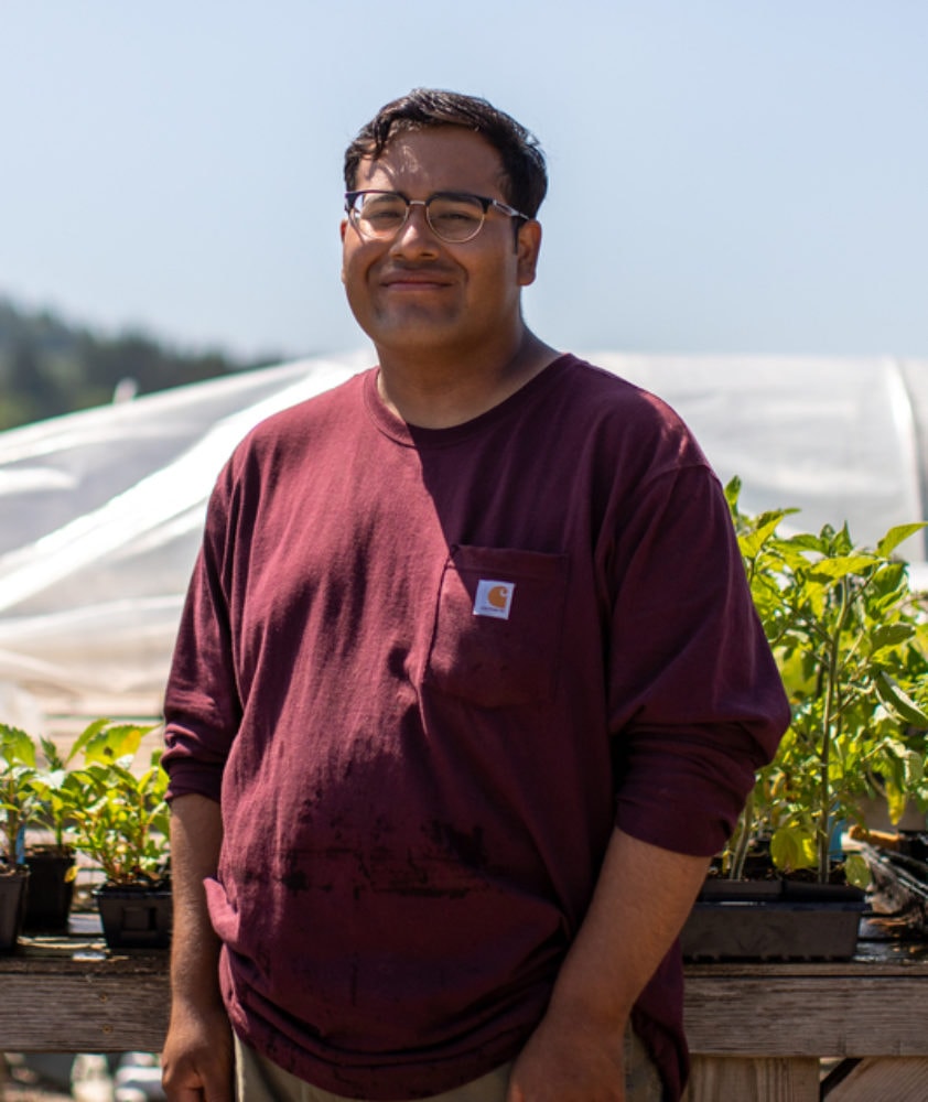 Portrait of Gonzalo Garcia Reyes, Farmer and Owner at Lomita Farm, discussing the healing power of growing culturally-significant foods for immigrant communities.